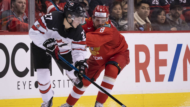 VANCOUVER, BC - DECEMBER 31: Saveli Olshanski #8 of Russia knocks Barrett Hayton #27 of Canada off the puck in Group A hockey action of the 2019 IIHF World Junior Championship on December, 31, 2018 at Rogers Arena in Vancouver, British Columbia, Canada.