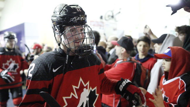 VICTORIA , BC - DECEMBER 21: Alexis Lafreniere #22 high fives with fans following a game versus Team Slovakia at the IIHF World Junior Championships at the Save-on-Foods Memorial Centre on December 21, 2018 in Victoria, British Columbia, Canada.