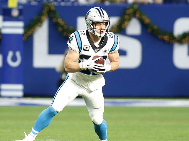 Download Christian Mccaffrey rushes the ball. Wallpaper