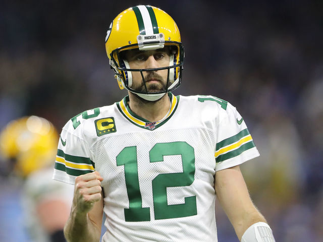 DETROIT, MI - DECEMBER 29: Aaron Rodgers #12 of the Green Bay Packers celebrates his touchdown pass to Davante Adams #17 of the Green Bay Packers in the third quarter against the Detroit Lions at Ford Field on December 29, 2019 in Detroit, Michigan.