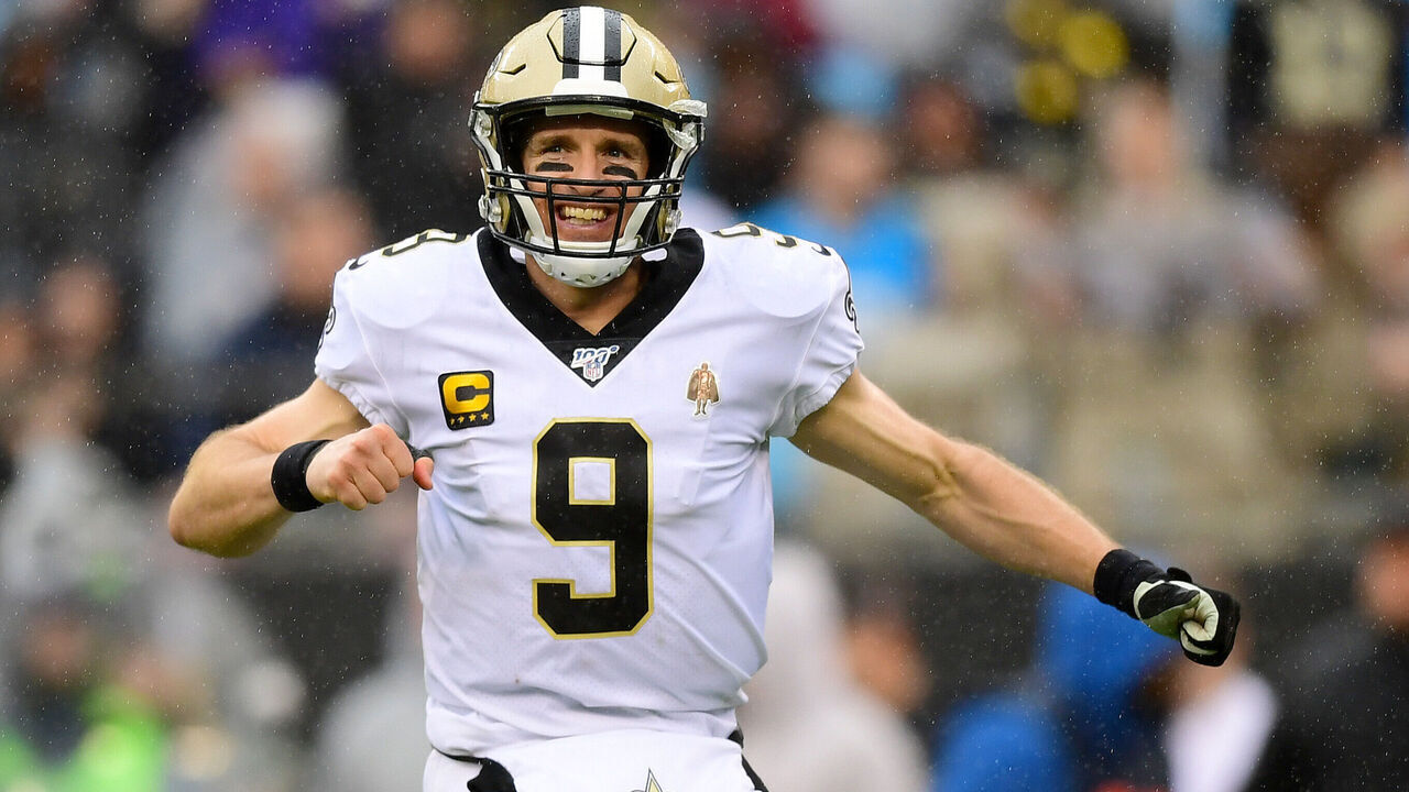 CHARLOTTE, NORTH CAROLINA - DECEMBER 29: Drew Brees #9 of the New Orleans Saints reacts after a touchdown pass during the third quarter during their game against the Carolina Panthers at Bank of America Stadium on December 29, 2019 in Charlotte, North Carolina.