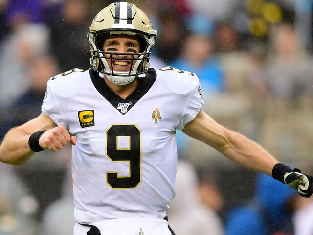 CHARLOTTE, NORTH CAROLINA - DECEMBER 29: Drew Brees #9 of the New Orleans Saints reacts after a touchdown pass during the third quarter during their game against the Carolina Panthers at Bank of America Stadium on December 29, 2019 in Charlotte, North Carolina.