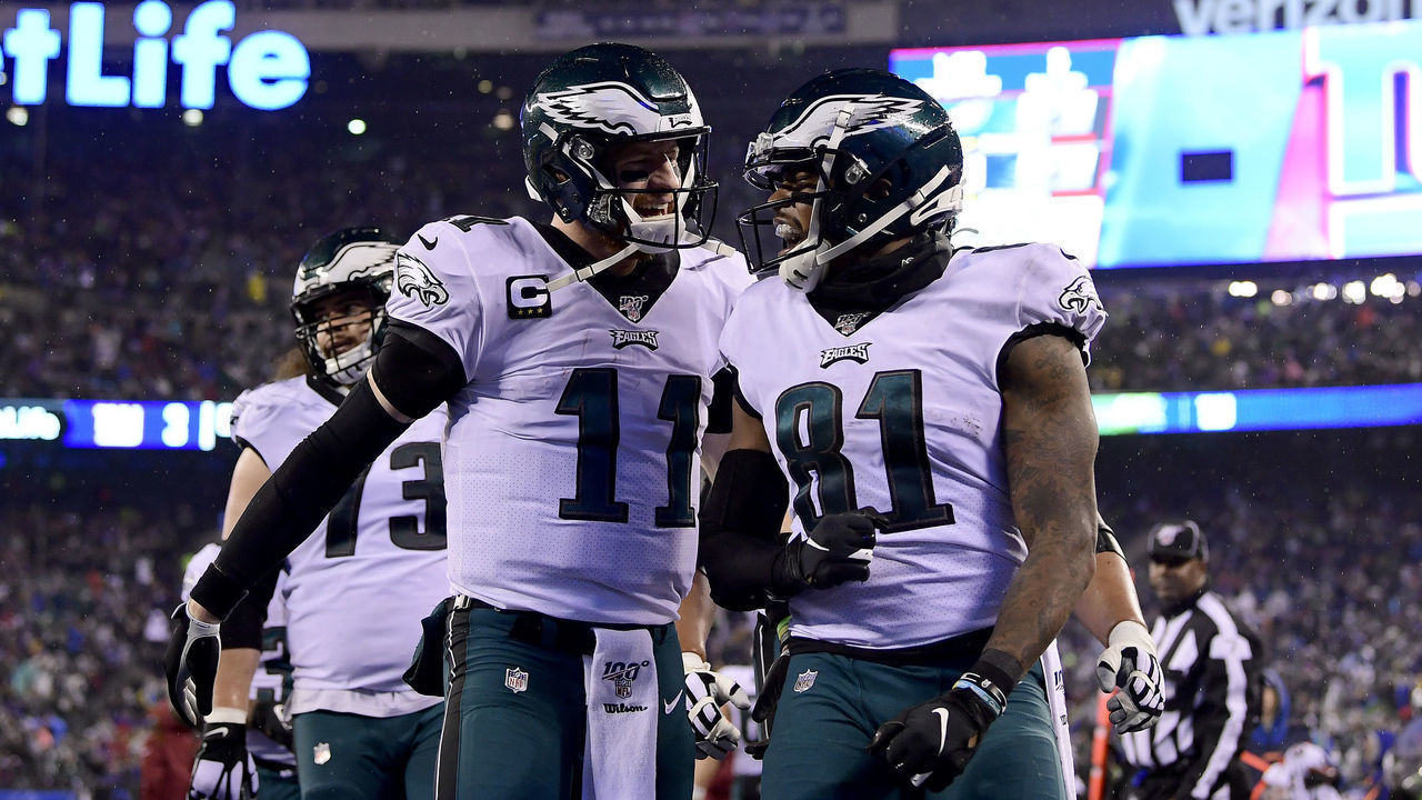 EAST RUTHERFORD, NEW JERSEY - DECEMBER 29: Josh Perkins #81 of the Philadelphia Eagles celebrates with Carson Wentz #11 after scoring a touchdown against the New York Giants during the second quarter in the game at MetLife Stadium on December 29, 2019 in East Rutherford, New Jersey.