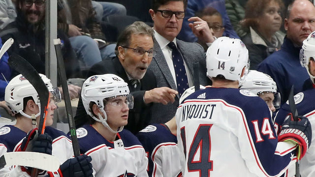 UNIONDALE, NEW YORK - DECEMBER 23: John Tortorella, head coach of the Columbus Blue Jackets handles bench duties against the New York Islanders at NYCB Live's Nassau Coliseum on December 23, 2019 in Uniondale, New York. With the game, Tortorella tied Jacques Martin for 13th place in the NHL in games coached with 1294. The Blue Jackets defeated the Islanders 3-2.