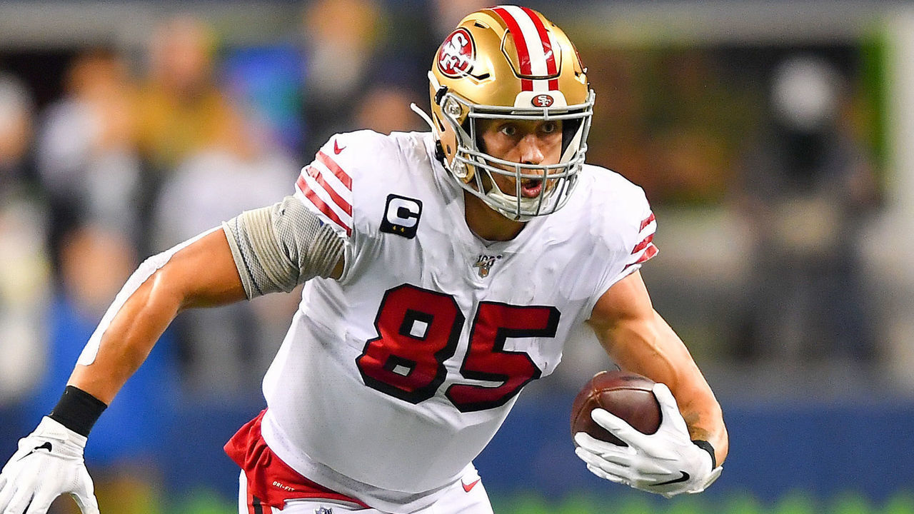 SEATTLE, WASHINGTON - DECEMBER 29: George Kittle #85 of the San Francisco 49ers runs for more yards after a catch from Jimmy Garoppolo during the first quarter of the game against the Seattle Seahawks at CenturyLink Field on December 29, 2019 in Seattle, Washington.