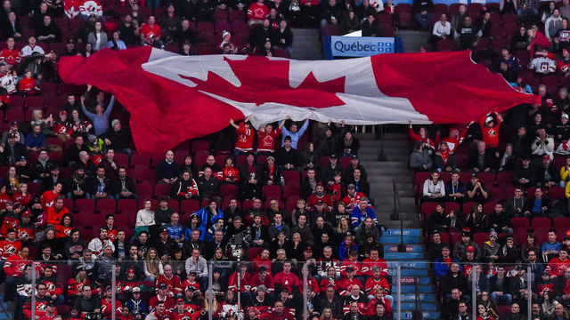 MONTREAL, QC - JANUARY 04: General view of fans passing a giant Canadian flag during the 2017 IIHF World Junior Championship semifinal game between Team Canada and Team Sweden at the Bell Centre on January 4, 2017 in Montreal, Quebec, Canada. Team Canada defeated Team Sweden 5-2 and move on to the gold medal round.