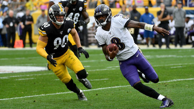 PITTSBURGH, PA - OCTOBER 06: Lamar Jackson #8 of the Baltimore Ravens scrambles under pressure from T.J. Watt #90 of the Pittsburgh Steelers in the first quarter during the game at Heinz Field on October 6, 2019 in Pittsburgh, Pennsylvania.
