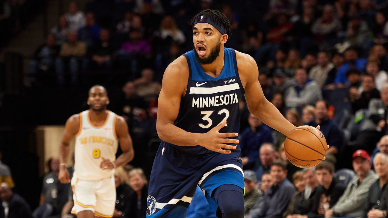 MINNEAPOLIS, MINNESOTA - NOVEMBER 08: Karl-Anthony Towns #32 of the Minnesota Timberwolves dribbles the ball against the Golden State Warriors during the game at Target Center on November 8, 2019 in Minneapolis, Minnesota.