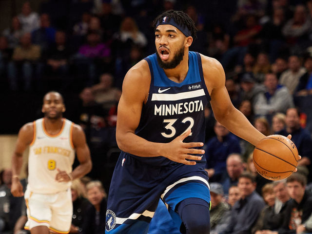 MINNEAPOLIS, MINNESOTA - NOVEMBER 08: Karl-Anthony Towns #32 of the Minnesota Timberwolves dribbles the ball against the Golden State Warriors during the game at Target Center on November 8, 2019 in Minneapolis, Minnesota.
