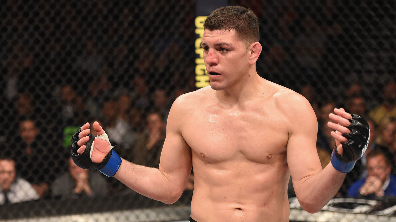 LAS VEGAS, NV - JANUARY 31: (R-L) Nick Diaz taunts Anderson Silva of Brazil in their middleweight bout during the UFC 183 event at the MGM Grand Garden Arena on January 31, 2015 in Las Vegas, Nevada.