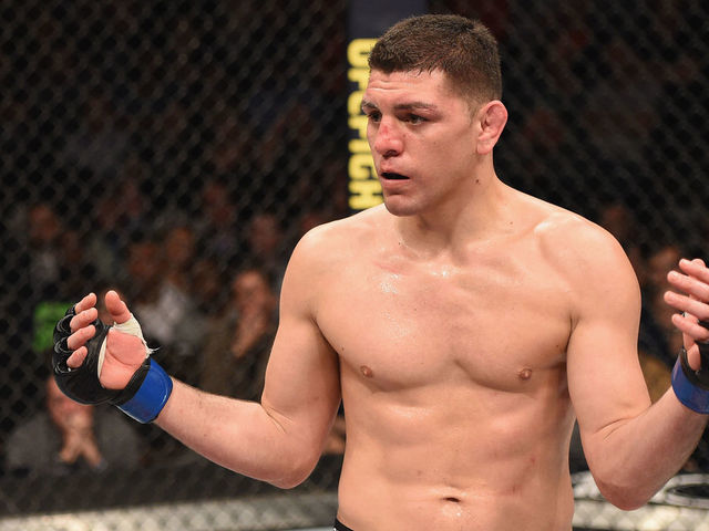 LAS VEGAS, NV - JANUARY 31: (R-L) Nick Diaz taunts Anderson Silva of Brazil in their middleweight bout during the UFC 183 event at the MGM Grand Garden Arena on January 31, 2015 in Las Vegas, Nevada.
