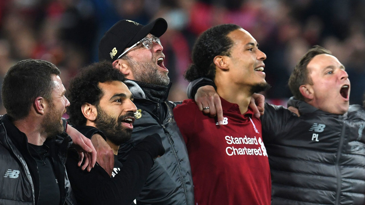 TOPSHOT - Liverpool's Egyptian midfielder Mohamed Salah (2L), Liverpool's German manager Jurgen Klopp (C) and Liverpool's Dutch defender Virgil van Dijk celebrate after winning the UEFA Champions league semi-final second leg football match between Liverpool and Barcelona at Anfield in Liverpool, north west England on May 7, 2019.