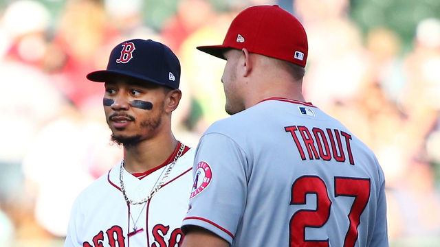 BOSTON, MA - JUNE 26: Mike Trout #27 of the Los Angeles Angels talks to Mookie Betts #50 of the Boston Red Sox before a game against the Boston Red Sox at Fenway Park on June 26, 2018 in Boston, Massachusetts.