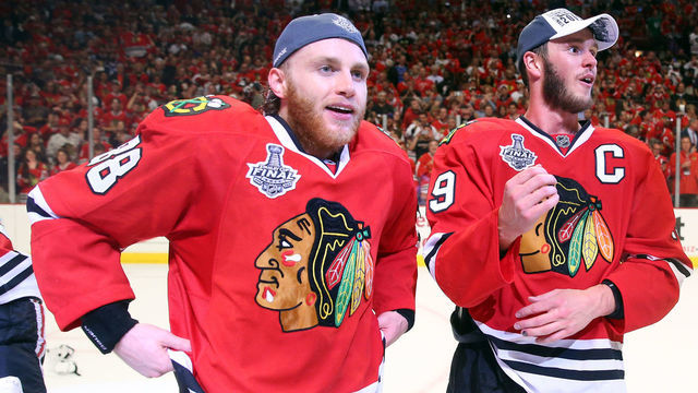 CHICAGO, IL - JUNE 15: Patrick Kane #88 and Jonathan Toews #19 of the Chicago Blackhawks celebrate after defeating the Tampa Bay Lightning by a score of 2-0 in Game Six to win the 2015 NHL Stanley Cup Final at the United Center on June 15, 2015 in Chicago, Illinois.