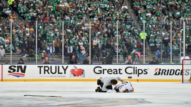 DALLAS, TX - JANUARY 1: Ryan Ellis #4 of the Nashville Predators receives some on-ice attention after taking a hit during the 2020 NHL Winter Classic between the Nashville Predators and the Dallas Stars at The Cotton Bowl on January 1, 2020 in Dallas, Texas.