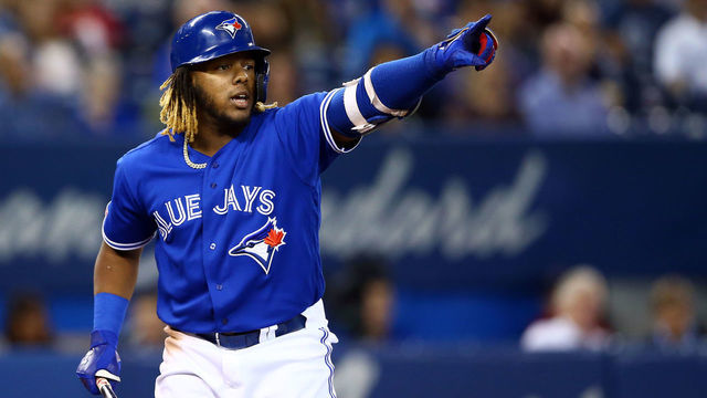TORONTO, ON - SEPTEMBER 25: Vladimir Guerrero Jr. #27 of the Toronto Blue Jays signals to the first base umpire in the fifth inning during a MLB game against the Baltimore Orioles at Rogers Centre on September 25, 2019 in Toronto, Canada.