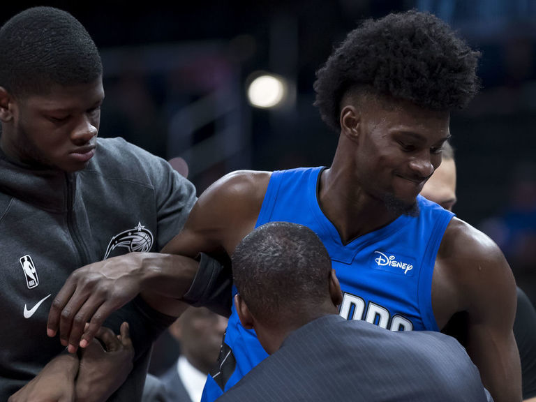 Magic forward Isaac stretchered off court with hyperextended knee