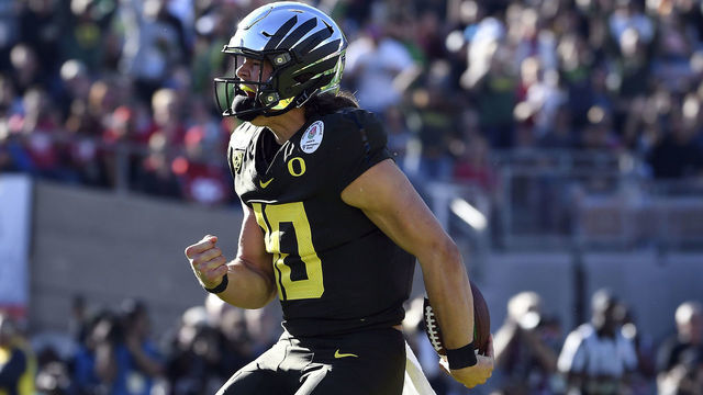 PASADENA, CALIFORNIA - JANUARY 01: Justin Herbert #10 of the Oregon Ducks celebrates after scoring a four yard touchdown against the Wisconsin Badgers during the first quarter in the Rose Bowl game presented by Northwestern Mutual at Rose Bowl on January 01, 2020 in Pasadena, California.