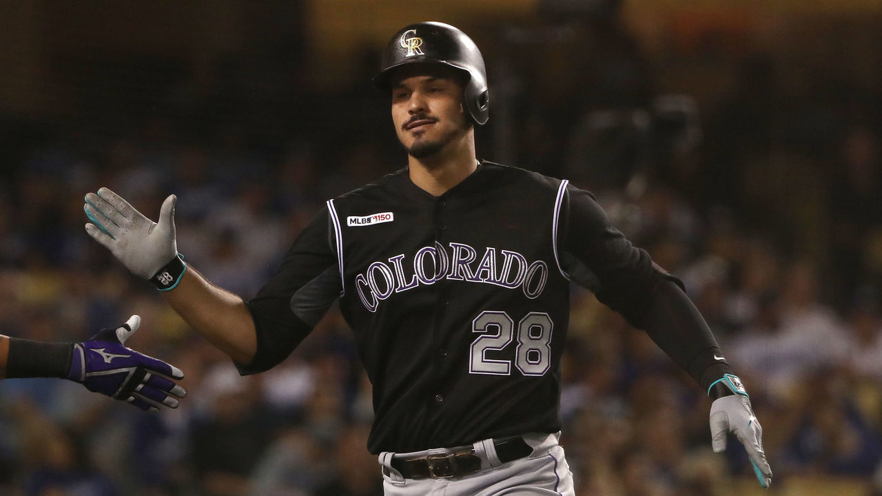 LOS ANGELES, CALIFORNIA - SEPTEMBER 03: Nolan Arenado #28 of the Colorado Rockies celebrates after hitting a solo home run in the fourth inning of the MLB game against the Los Angeles Dodgers at Dodger Stadium on September 03, 2019 in Los Angeles, California.
