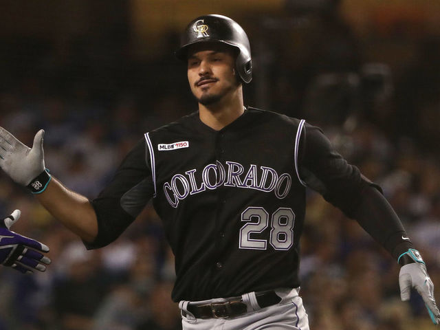 LOS ANGELES, CALIFORNIA - SEPTEMBER 03: Nolan Arenado #28 of the Colorado Rockies celebrates after hitting a solo home run in the fourth inning of the MLB game against the Los Angeles Dodgers at Dodger Stadium on September 03, 2019 in Los Angeles, California.