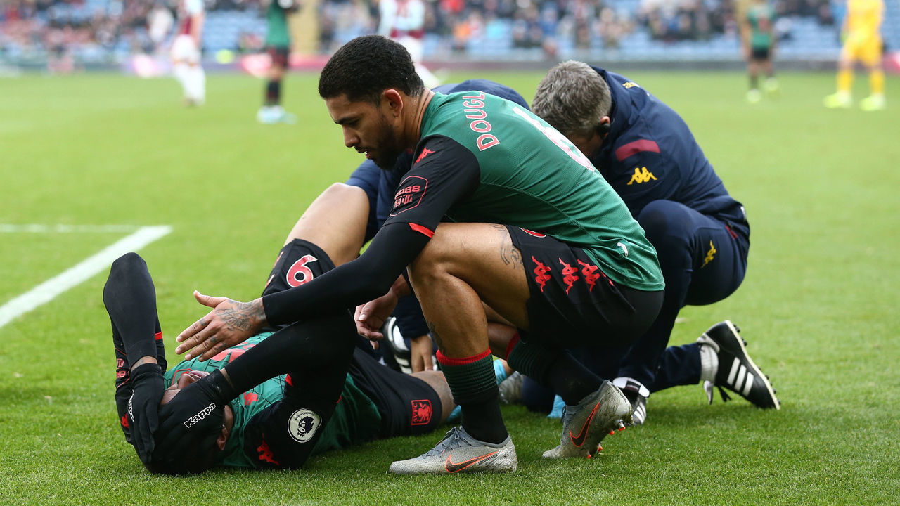 BURNLEY, ENGLAND - JANUARY 01: Wesley of Aston Villa receives medical attention during the Premier League match between Burnley FC and Aston Villa at Turf Moor on January 01, 2020 in Burnley, United Kingdom.