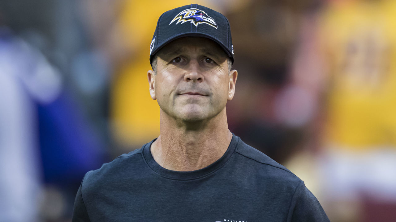 LANDOVER, MD - AUGUST 29: Head coach John Harbaugh of the Baltimore Ravens takes the field before a preseason game against the Washington Redskins at FedExField on August 29, 2019 in Landover, Maryland.