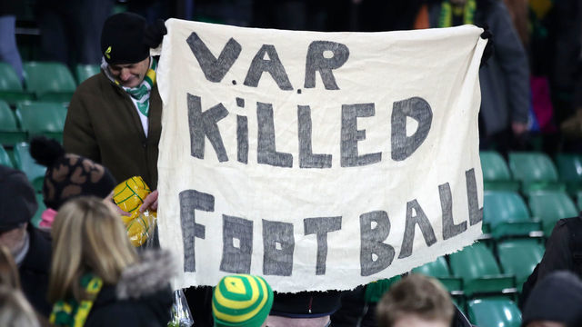 NORWICH, ENGLAND - JANUARY 01: A Norwich City fan holds an anti VAR sign during the Premier League match between Norwich City and Crystal Palace at Carrow Road on January 01, 2020 in Norwich, United Kingdom.