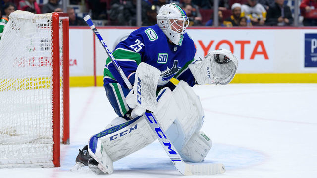 VANCOUVER, BC - DECEMBER 21: Vancouver Canucks Goaltender Jacob Markstrom (25) watches the play during their NHL game against the Pittsburgh Penguins at Rogers Arena on December 21, 2019 in Vancouver, British Columbia, Canada.