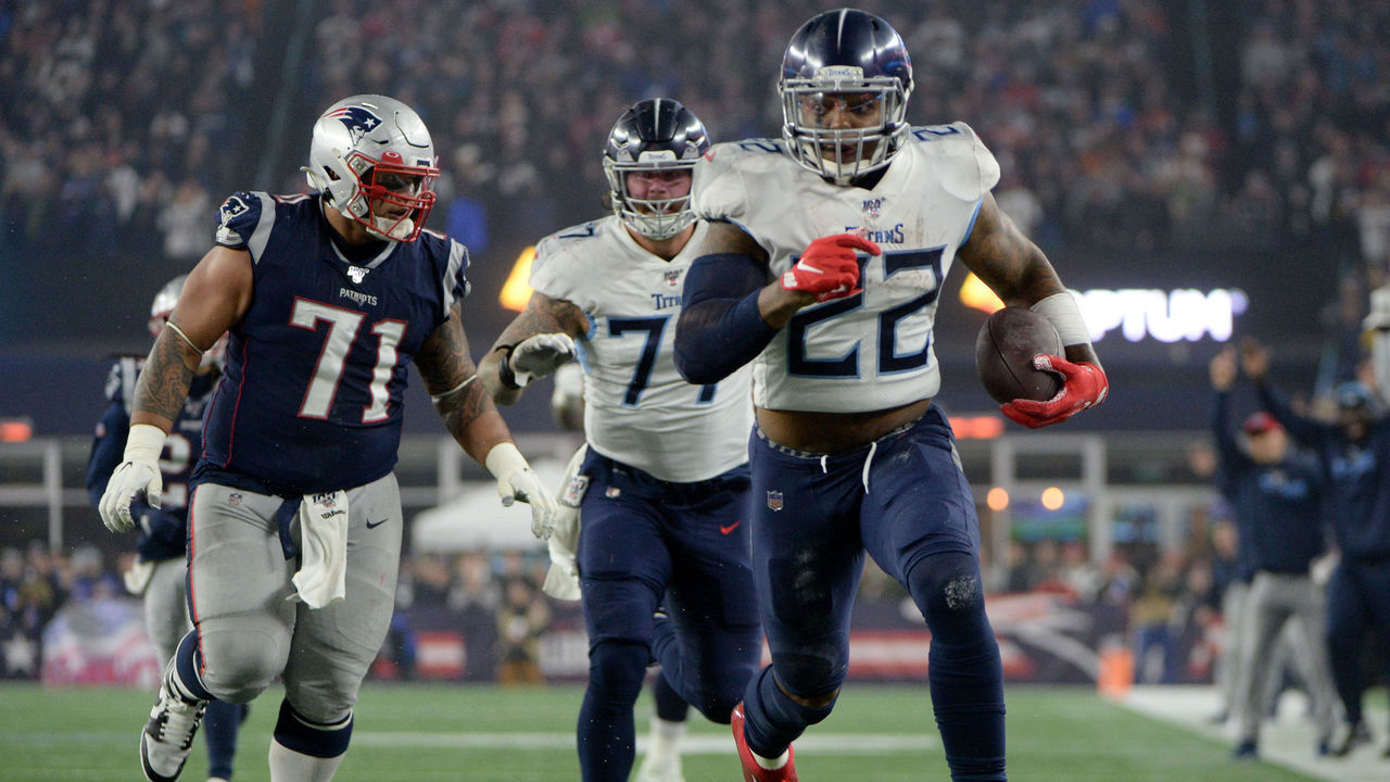 FOXBOROUGH, MASSACHUSETTS - JANUARY 04: Derrick Henry #22 of the Tennessee Titans carries the ball against Danny Shelton #71 of the New England Patriots in the second quarter of the AFC Wild Card Playoff game at Gillette Stadium on January 04, 2020 in Foxborough, Massachusetts.