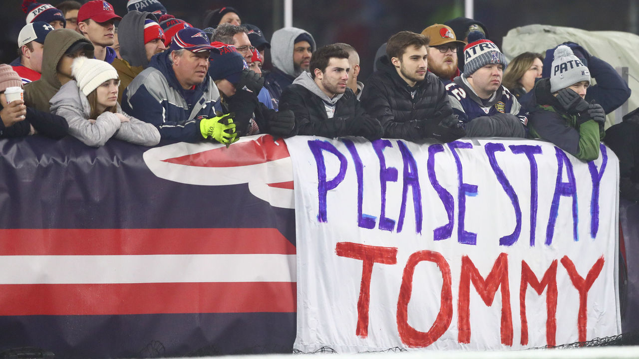 FOXBOROUGH, MASSACHUSETTS - JANUARY 04: Fans of the New England Patriots hold a sign that reads, "Please Stay Tommy" as they take on the Tennessee Titans in the AFC Wild Card Playoff game at Gillette Stadium on January 04, 2020 in Foxborough, Massachusetts.