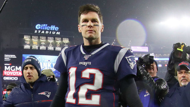 FOXBOROUGH, MASSACHUSETTS - JANUARY 04: Tom Brady #12 of the New England Patriots walks off the field after their 20-13 loss to the Tennessee Titans in the AFC Wild Card Playoff game at Gillette Stadium on January 04, 2020 in Foxborough, Massachusetts.