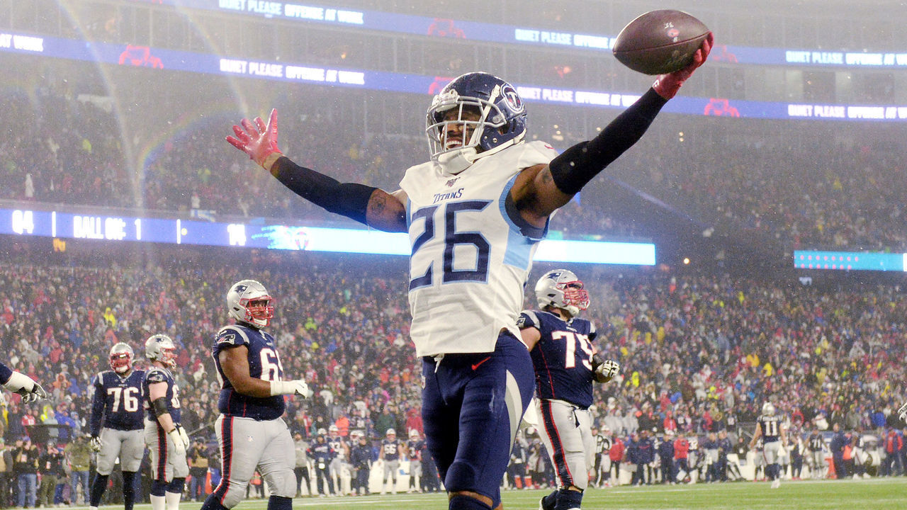 FOXBOROUGH, MASSACHUSETTS - JANUARY 04: Logan Ryan #26 of the Tennessee Titans scores a touchdown against the New England Patriots in the fourth quarter of the AFC Wild Card Playoff game at Gillette Stadium on January 04, 2020 in Foxborough, Massachusetts.