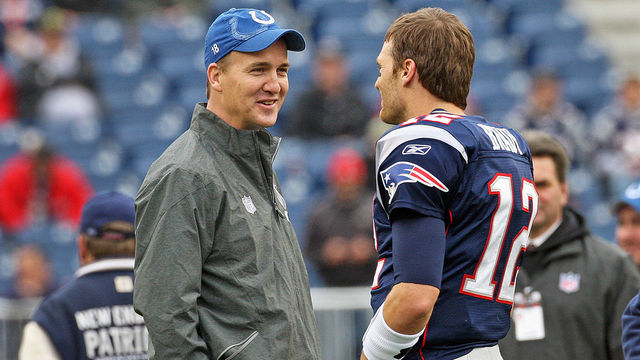 FOXBOROUGH - DECEMBER 4: Injured Colts quarterback Peyton Maning chats with Patriots quarterback Tom Brady on the field before the game. The New England Patriots hosted the Indianapolis Colts in an NFL regular season game at Gillette Stadium.