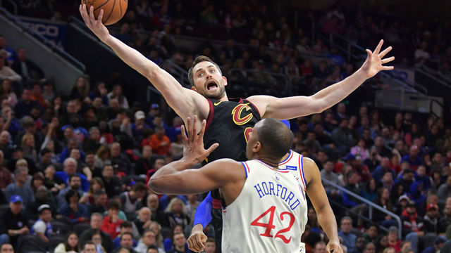 PHILADELPHIA, PA - DECEMBER 07: Kevin Love #0 of the Cleveland Cavaliers grabs a rebound above Al Horford #42 of the Philadelphia 76ers in the first half at Wells Fargo Center on December 7, 2019 in Philadelphia, Pennsylvania.