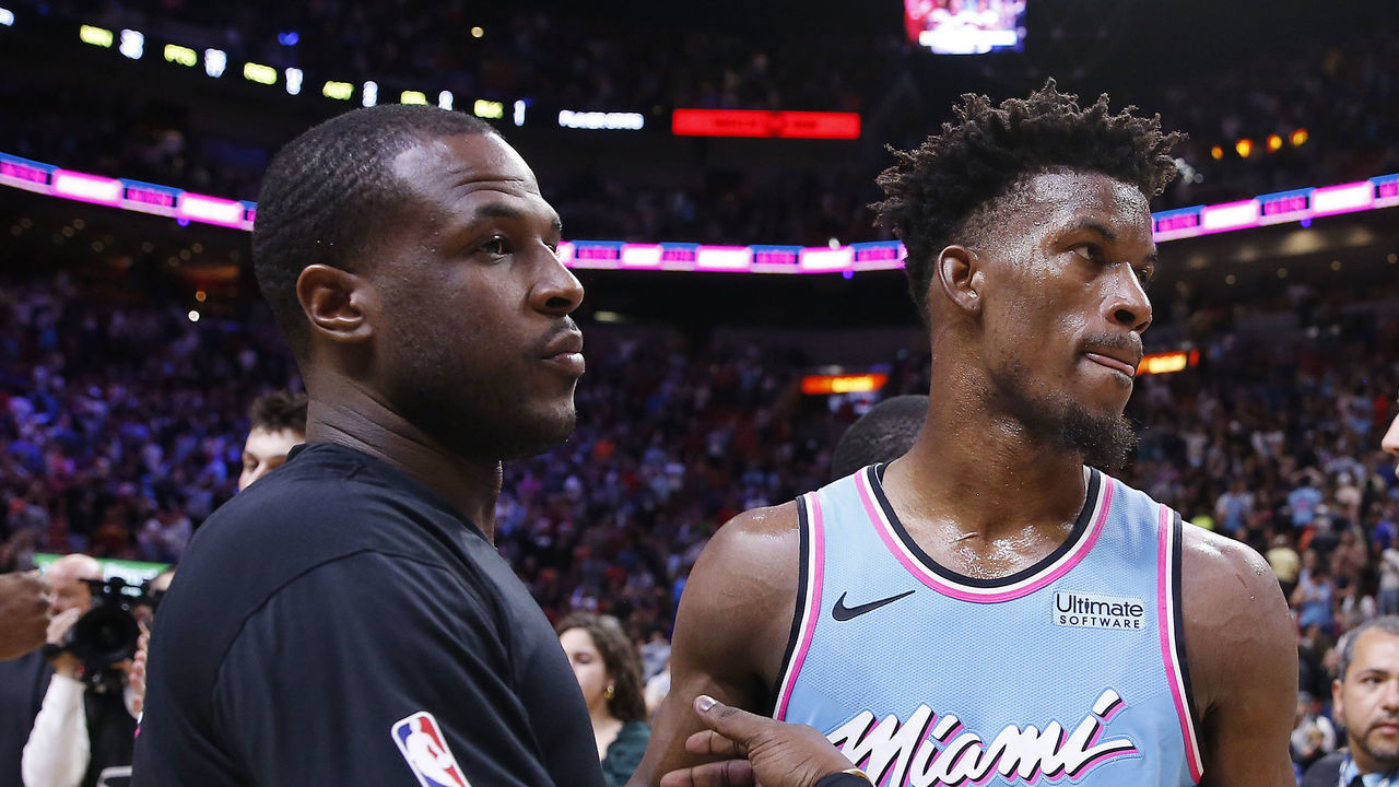 MIAMI, FLORIDA - DECEMBER 28: Jimmy Butler #22 of the Miami Heat celebrates with Dion Waiters #11 against the Philadelphia 76ers after the game at American Airlines Arena on December 28, 2019 in Miami, Florida. NOTE TO USER: User expressly acknowledges and agrees that, by downloading and/or using this photograph, user is consenting to the terms and conditions of the Getty Images License Agreement.