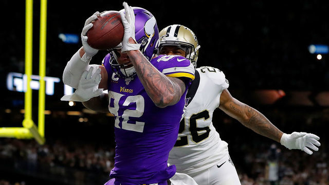 NEW ORLEANS, LOUISIANA - JANUARY 05: Kyle Rudolph #82 of the Minnesota Vikings makes the game-winning touchdown reception against P.J. Williams #26 of the New Orleans Saints during overtime in the NFC Wild Card Playoff game at Mercedes Benz Superdome on January 05, 2020 in New Orleans, Louisiana.