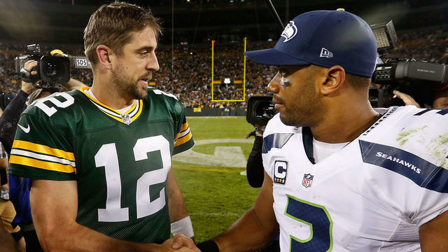 GREEN BAY, WI - SEPTEMBER 20: Quarterbacks Aaron Rodgers #12 of the Green Bay Packers and Russell Wilson #3 of the Seattle Seahawks shake hands following the NFL game at Lambeau Field on September 20, 2015 in Green Bay, Wisconsin. The Packers defeated the Seahawks 27-17.