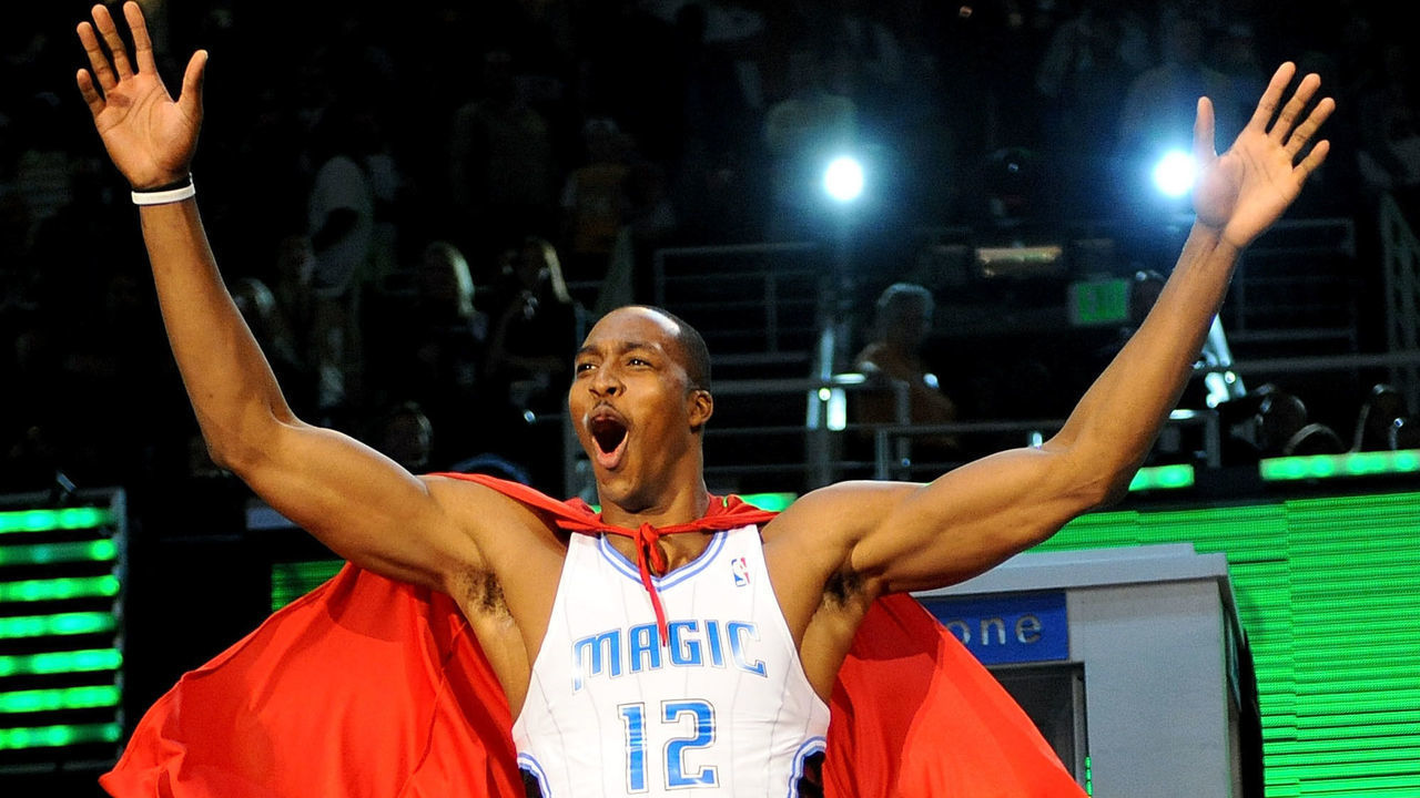 PHOENIX - FEBRUARY 14: Dwight Howard of the Orlando Magic emerges from a phone booth wearing a Superman cape during the Sprite Slam Dunk Contest on All-Star Saturday Night, part of 2009 NBA All-Star Weekend at US Airways Center on February 14, 2009 in Phoenix, Arizona.