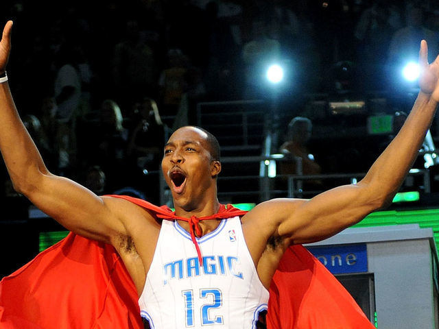 PHOENIX - FEBRUARY 14: Dwight Howard of the Orlando Magic emerges from a phone booth wearing a Superman cape during the Sprite Slam Dunk Contest on All-Star Saturday Night, part of 2009 NBA All-Star Weekend at US Airways Center on February 14, 2009 in Phoenix, Arizona.