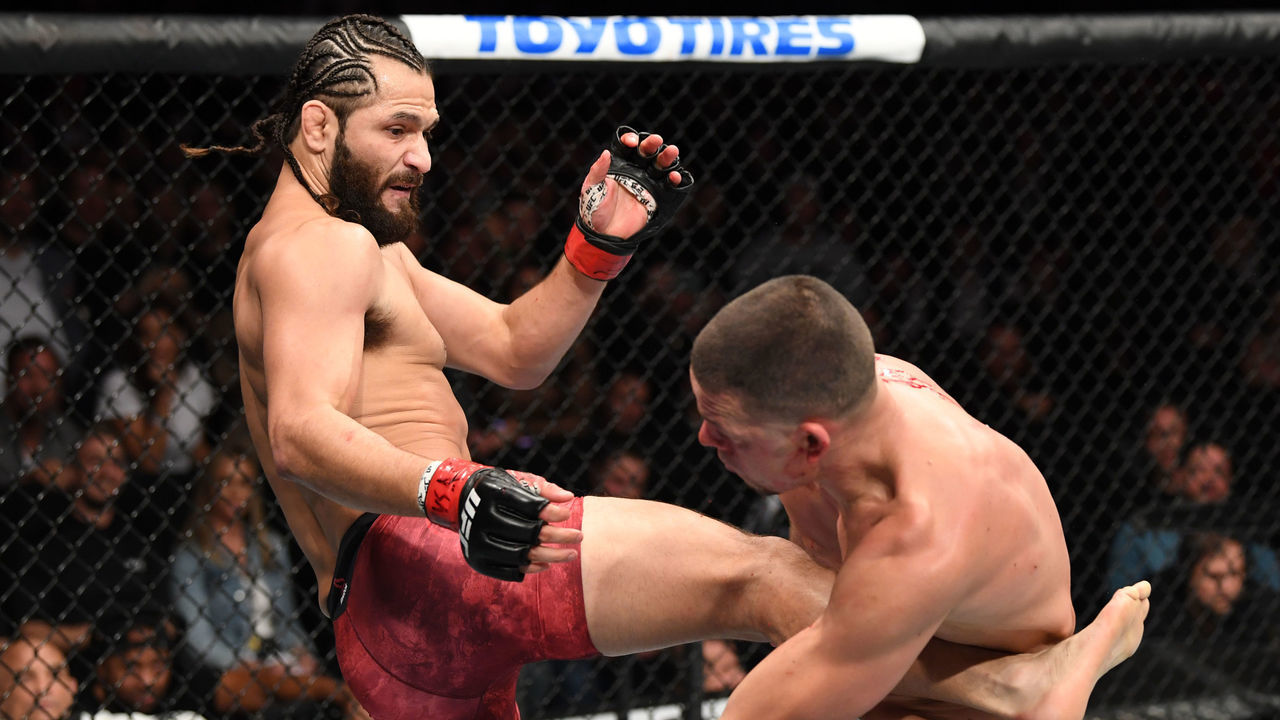 NEW YORK, NEW YORK - NOVEMBER 02: (L-R) Jorge Masvidal kicks Nate Diaz in their welterweight bout for the BMF title during the UFC 244 event at Madison Square Garden on November 02, 2019 in New York City.