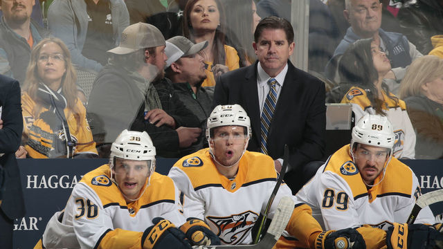 DALLAS, TX - NOVEMBER 10: Peter Laviolette of the Nashville Predators watches the action from behind the bench against the Dallas Stars at the American Airlines Center on November 10, 2018 in Dallas, Texas.