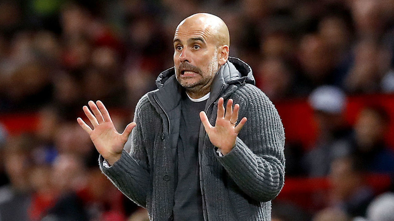 Manchester City manager Pep Guardiola on the touchline during the Premier League match at Old Trafford, Manchester.