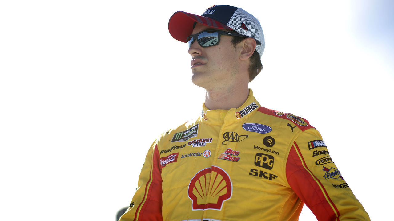 HOMESTEAD, FLORIDA - NOVEMBER 17: Joey Logano, driver of the #22 Shell Pennzoil Ford, stands on the grid during the Monster Energy NASCAR Cup Series Ford EcoBoost 400 at Homestead Speedway on November 17, 2019 in Homestead, Florida.