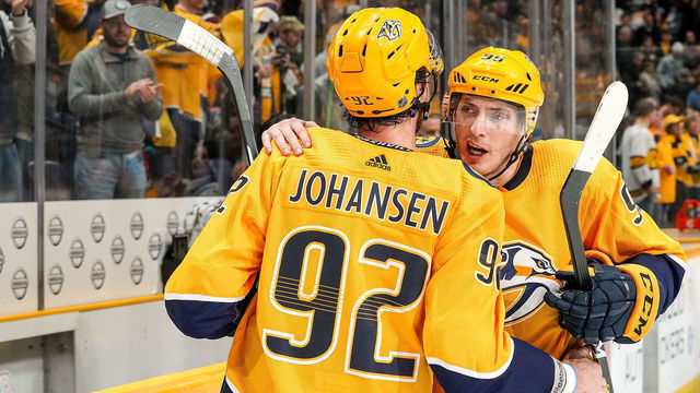 NASHVILLE, TN - DECEMBER 14: Matt Duchene #95 congratulates Ryan Johansen #92 of the Nashville Predators after a 3-2 win against the Arizona Coyotes at Bridgestone Arena on December 14, 2019 in Nashville, Tennessee.