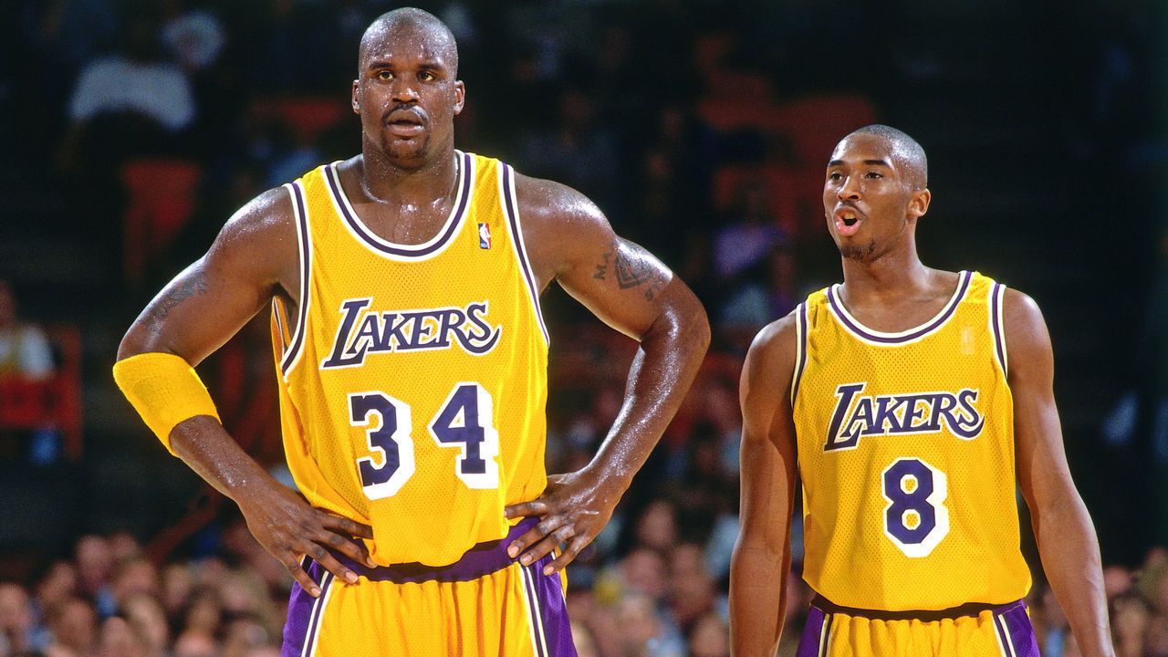 INGLEWOOD, CA - NOVEMBER 20: Shaquille O'Neal #32 and Kobe Bryant #8 of the Los Angeles Lakers look on against the Utah Jazz on November 20, 1996 at the Great Western Forum in Inglewood, California. Mandatory Copyright Notice: Copyright 1996 NBAE