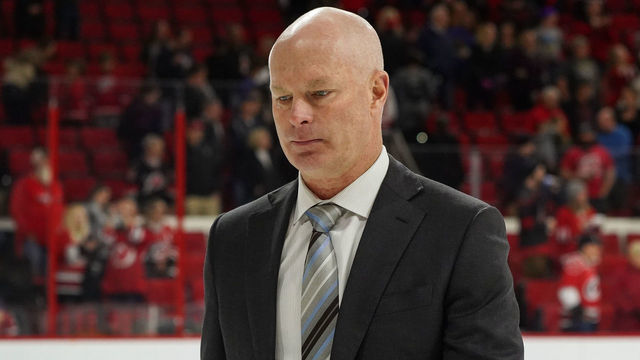RALEIGH, NC - NOVEMBER 18: New Jersey Devils head coach John Hynes walks off the ice during a game between the Carolina Hurricanes and the New Jersey Devils at the PNC Arena in Raleigh, NC on November 18, 2018.