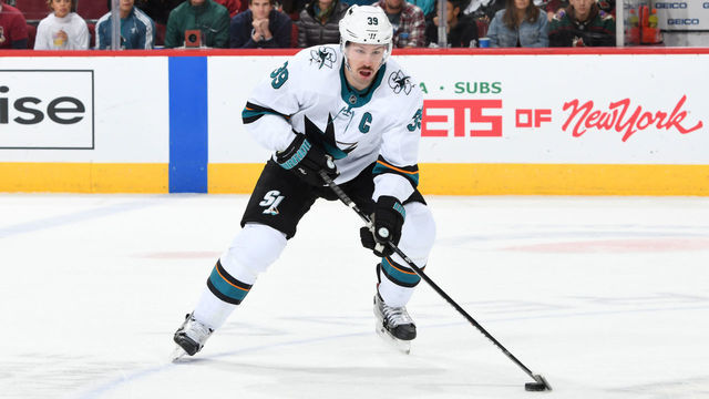 GLENDALE, ARIZONA - NOVEMBER 30: Logan Couture #39 of the San Jose Sharks skates the puck up ice against the Arizona Coyotes at Gila River Arena on November 30, 2019 in Glendale, Arizona.