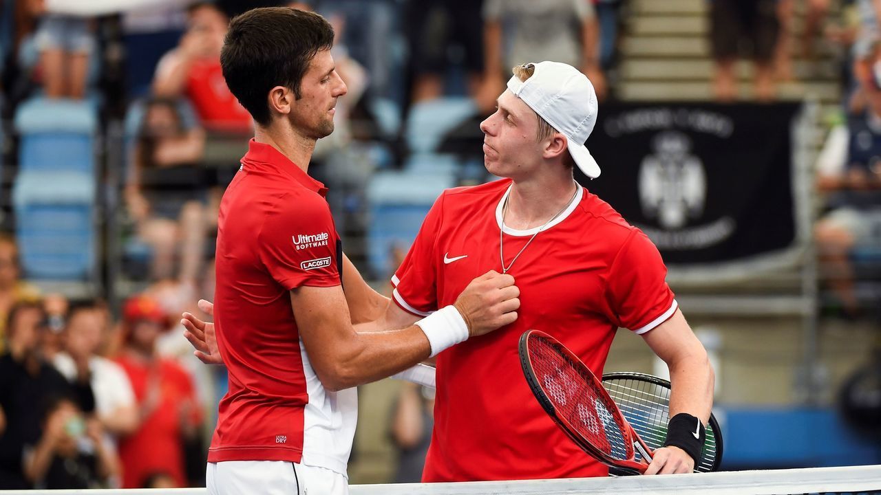 Novak Djokovic of Serbia (L) speaks with Denis Shapovalov of Canada after winning their men's singles match at the ATP Cup tennis tournament in Sydney on January 10, 2020.