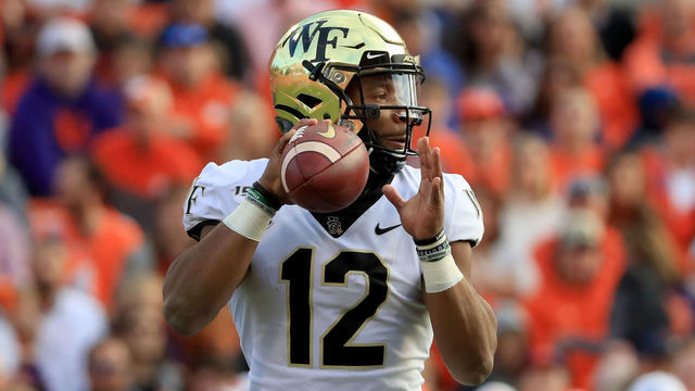 CLEMSON, SOUTH CAROLINA - NOVEMBER 16: Jamie Newman #12 of the Wake Forest Demon Deacons during their game at Memorial Stadium on November 16, 2019 in Clemson, South Carolina.