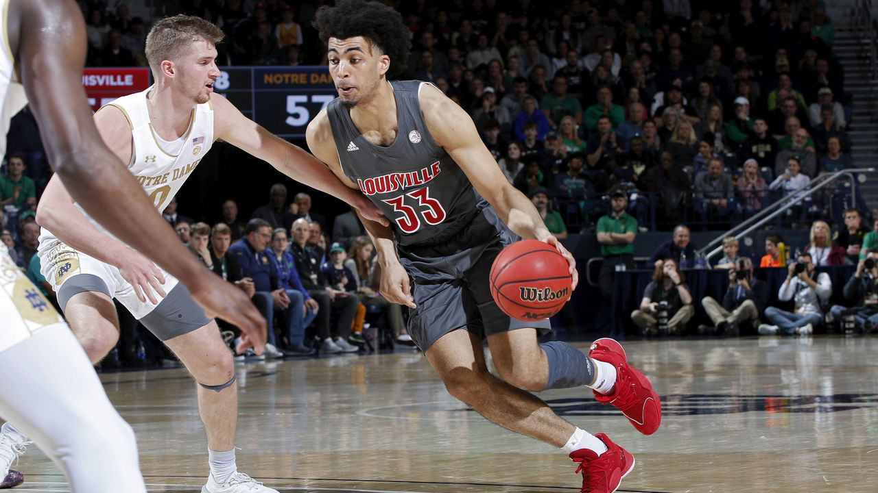 SOUTH BEND, IN - JANUARY 11: Jordan Nwora #33 of the Louisville Cardinals drives to the basket in the second half of the game against the Notre Dame Fighting Irish at Purcell Pavilion on January 11, 2020 in South Bend, Indiana. Louisville defeated Notre Dame 67-64.
